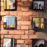 Windows VIII | Paintings | Noemi Staniszewska | "Windows VIII"Original oil painting by Noemi StaniszewskaThe Windows series is a pictorial tale of urban walks through the residential neighborhoods of the Hague. It is the result of observing the uncovered windows of Dutch houses, a recording of fragments of someone else's reality – intimate and yet exposed to public view.The window here is the boundary between private and foreign. It is a place where gazes meet, place of confrontation with what is outside. In this case, the situation of looking in the windows is also an expression of the emigration experience – the observer, although sees, remains outside of what he looks at, as always an outsider. Voyeurism is a manifestation of curiosity, perhaps longing, but at the same time it involves a violation of boundaries. | Beauton Art Gallery paintings, aesthetic, figurative, graphical, minimalistic, architecture, everyday life, patterns, people, beige, black, yellow, cotton-canvas, oil, beautiful, contemporary-art, decorative, design, interior, interior-design, modern, modern-art, windows, Buy original high quality art. Paintings, drawings, limited edition prints & posters by talented artists.